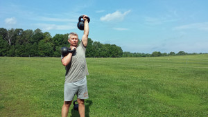 mark mellohusky double kettlebell workout squats push presses farmers walk
