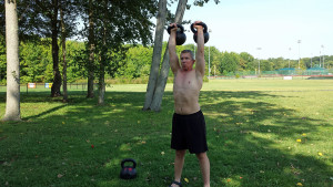 Double kettlebell overhead carries will drive your fitness to new heights