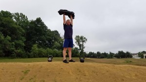 mark mellohusky full body exercises sandbag press