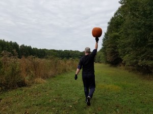 mark mellohusky farmers walk overhead carry Halloween pumpkin outdoor gym