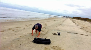 Total Body Beach Workout: Sandbag Presses And Bear Crawls