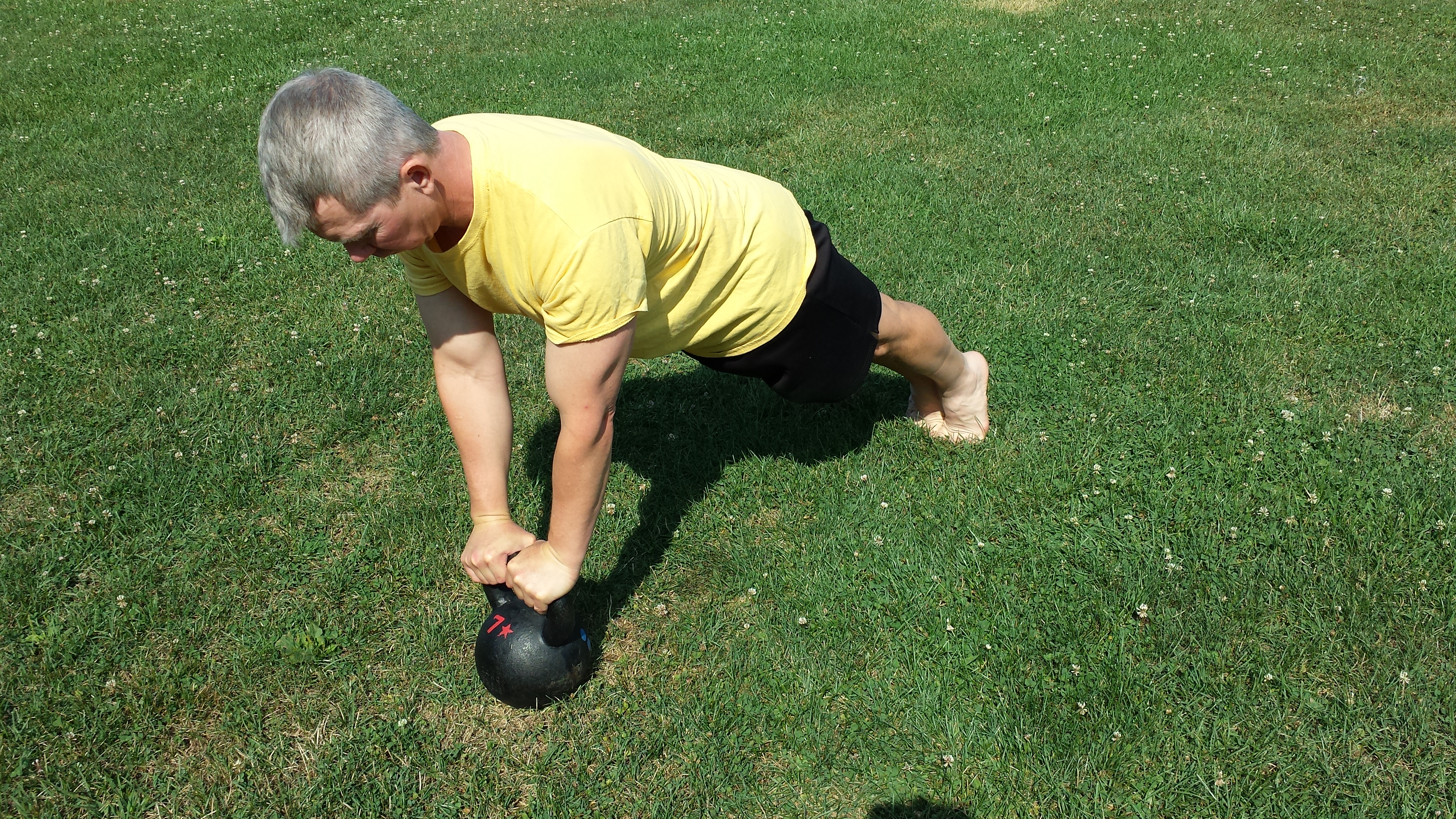 mark mellohusky kettlebell plank outdoor workout seven stars fitness